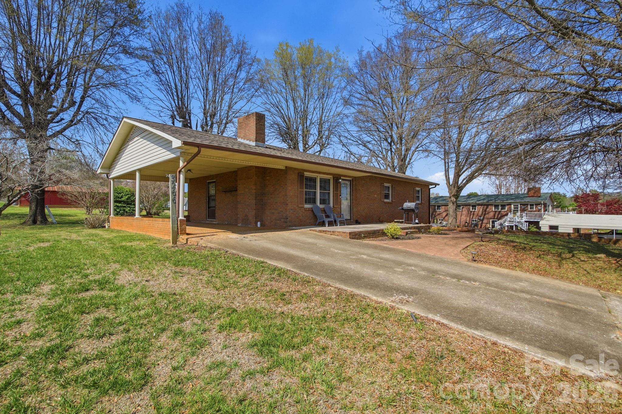 3266 Coble Dairy Road Hudson, NC 28638 - Photo 34 of 37 a front view of a house with a yard and garage