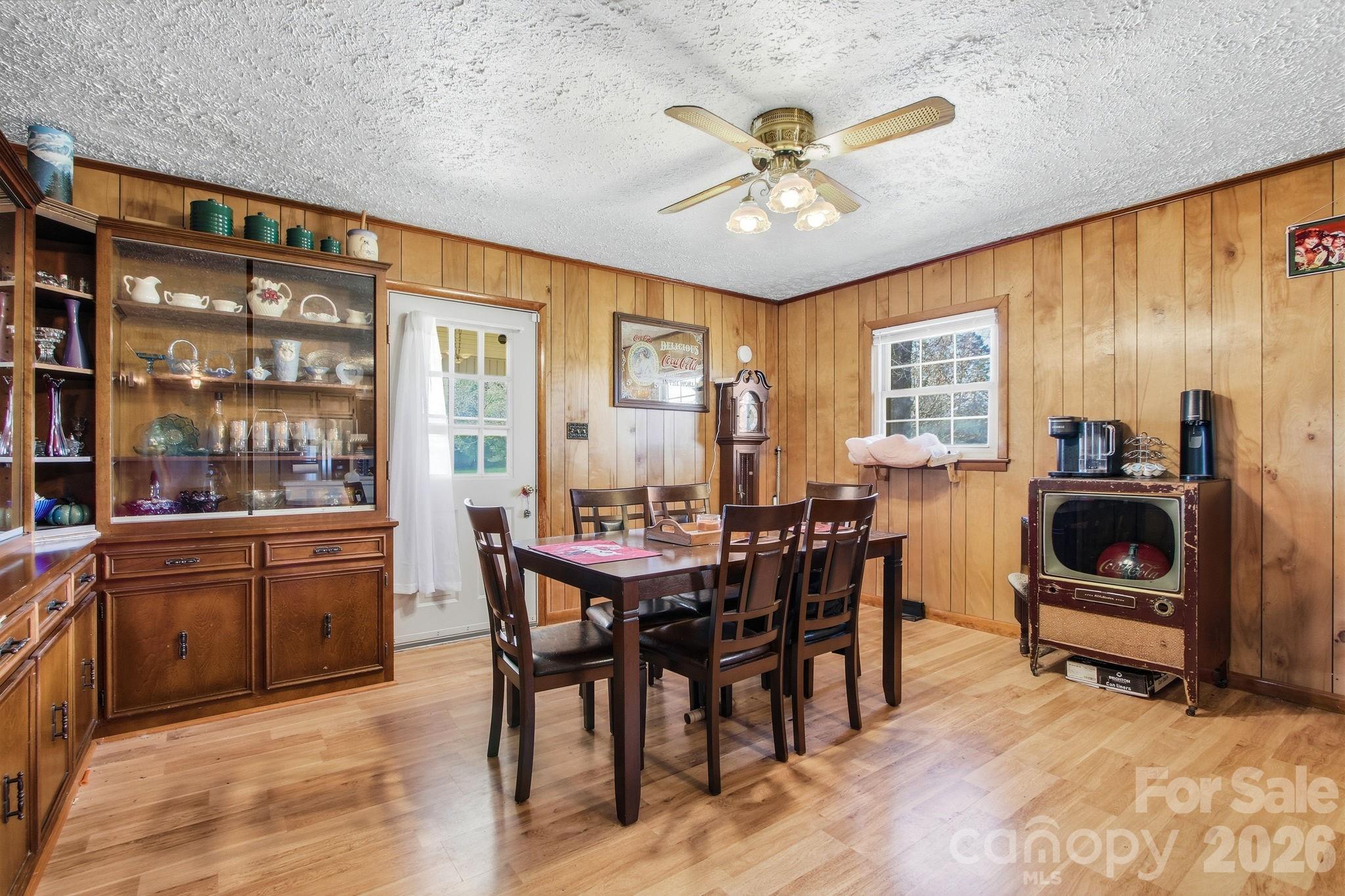 3266 Coble Dairy Road Hudson, NC 28638 - Photo 7 of 37 a view of a dining room with furniture window and wooden floor