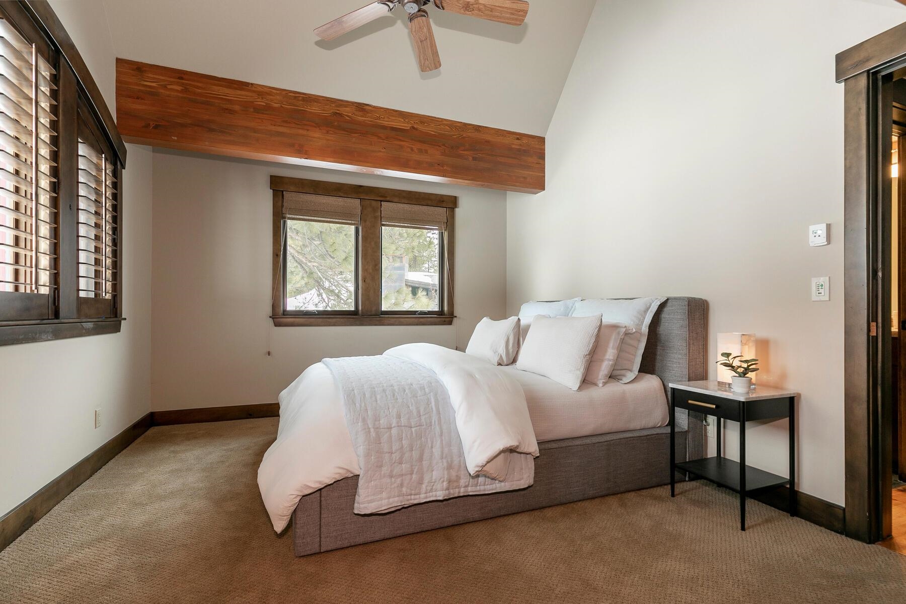 13006 Lookout Loop Truckee, CA 96161 - Photo 17 of 21 a spacious bedroom with a bed and a window