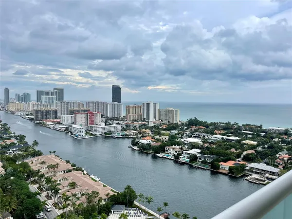 an aerial view of a house with a lake view