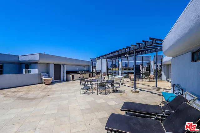 a view of a patio with swimming pool table and chairs
