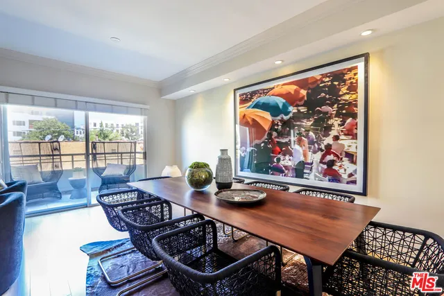 a living room with furniture pool table and a large window