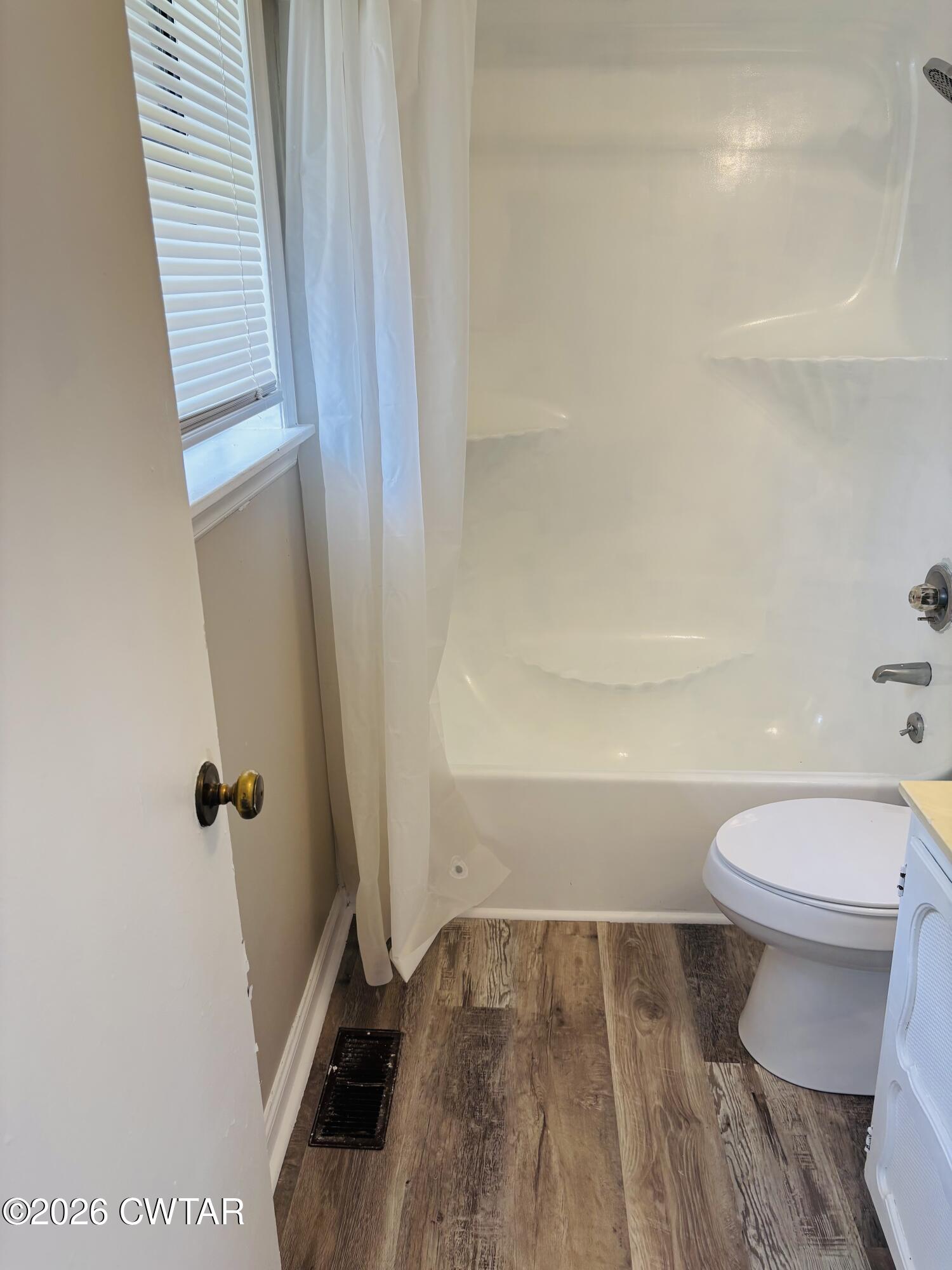 149 Commanche Trail Jackson, TN 38305 - Photo 12 of 15 a bathroom with a toilet and a shower