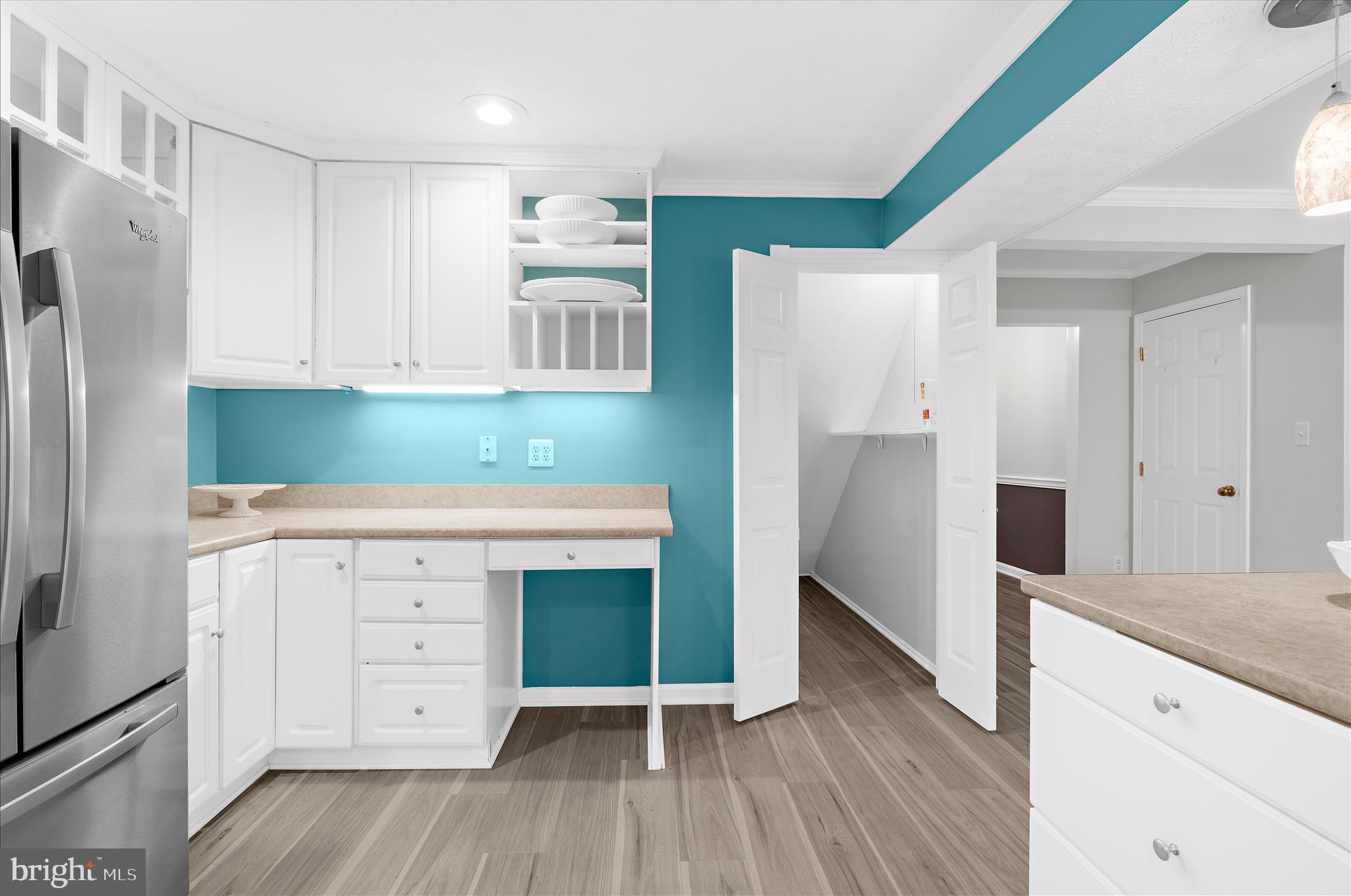 1126 Neptune Place Annapolis, MD 21409 - Photo 15 of 79 a kitchen with white cabinets and a refrigerator