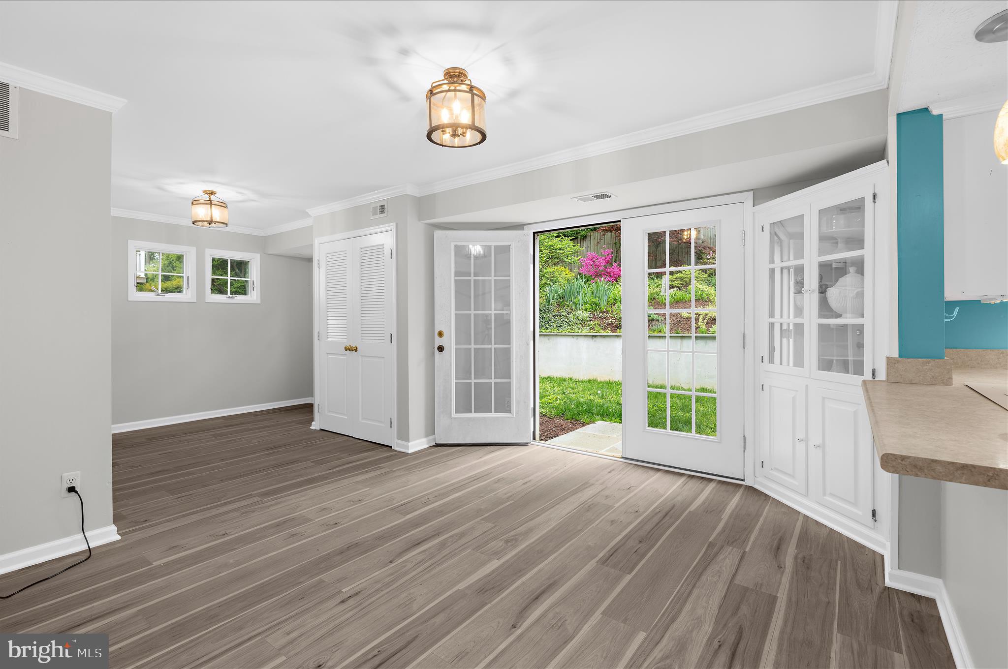 1126 Neptune Place Annapolis, MD 21409 - Photo 17 of 79 a view of an empty room with a window and wooden floor