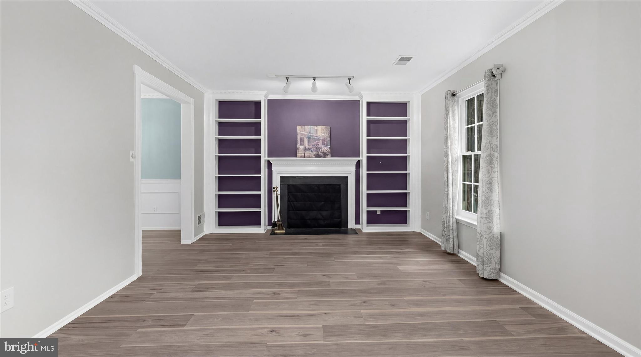 1126 Neptune Place Annapolis, MD 21409 - Photo 2 of 79 a view of an empty room with a fireplace and a window