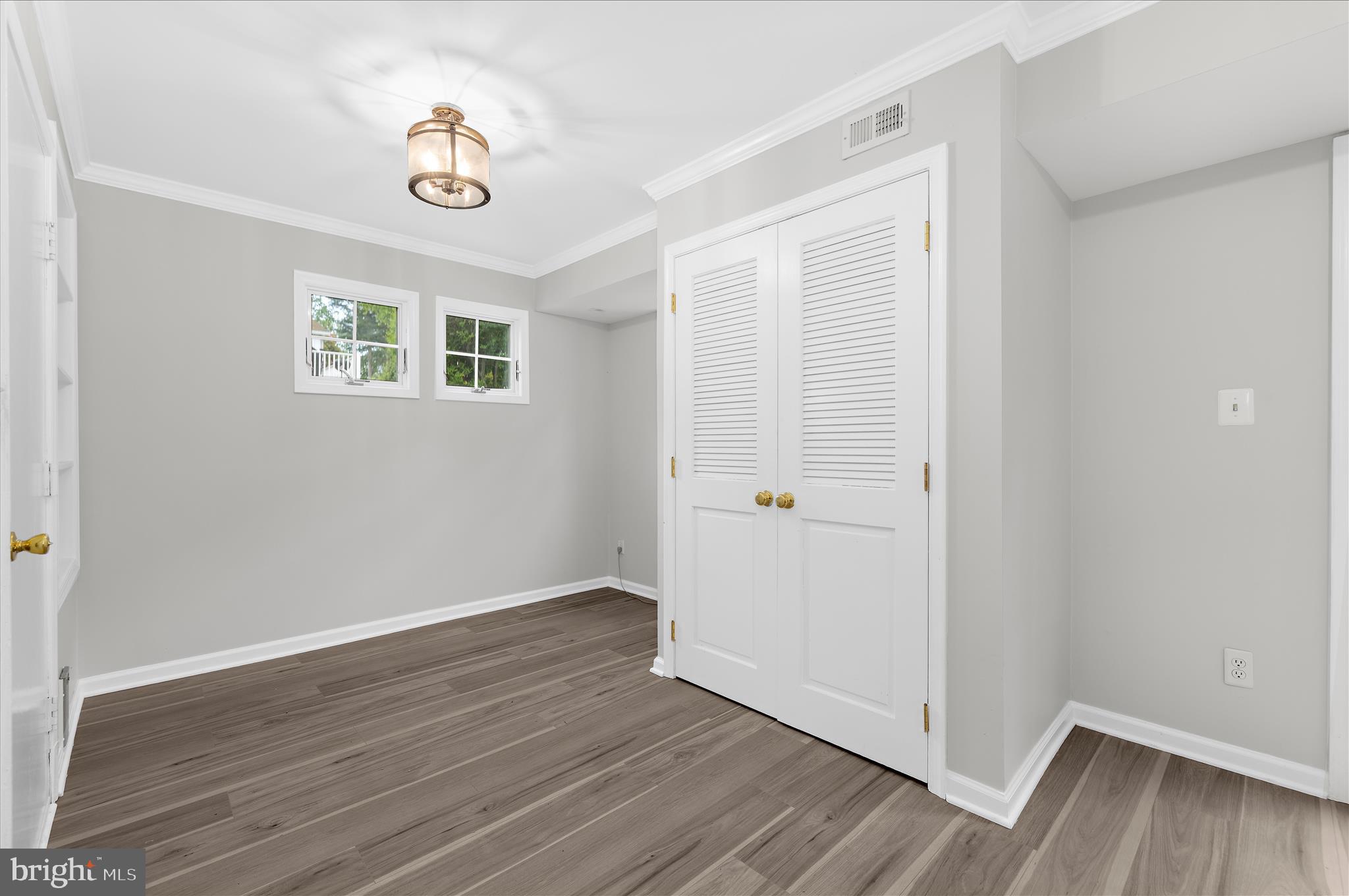 1126 Neptune Place Annapolis, MD 21409 - Photo 22 of 79 an empty room with wooden floor and ceiling fan