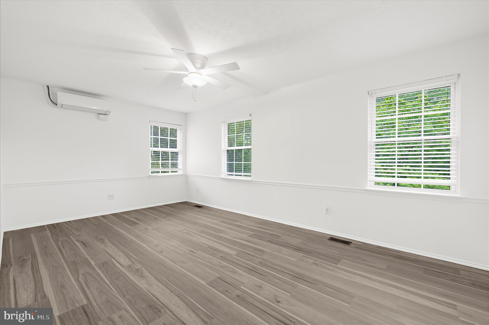 1126 Neptune Place Annapolis, MD 21409 - Photo 33 of 79 a view of an empty room with wooden floor and a window