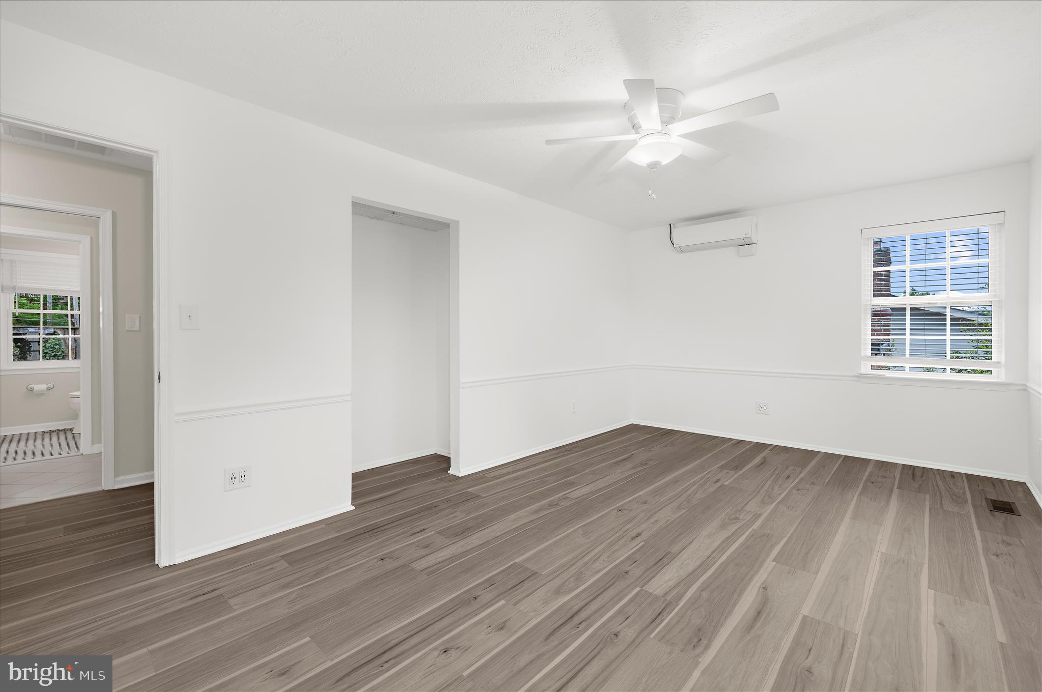 1126 Neptune Place Annapolis, MD 21409 - Photo 34 of 79 wooden floor in an empty room with a window