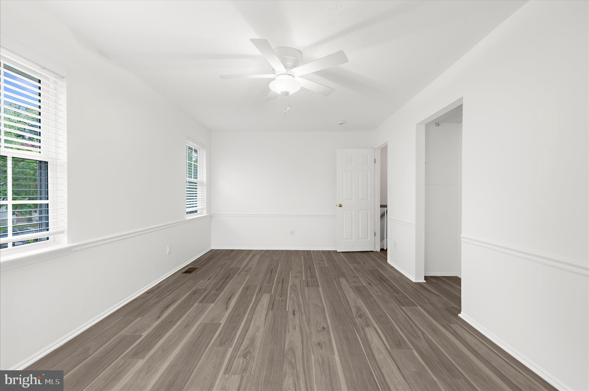 1126 Neptune Place Annapolis, MD 21409 - Photo 35 of 79 an empty room with wooden floor and windows
