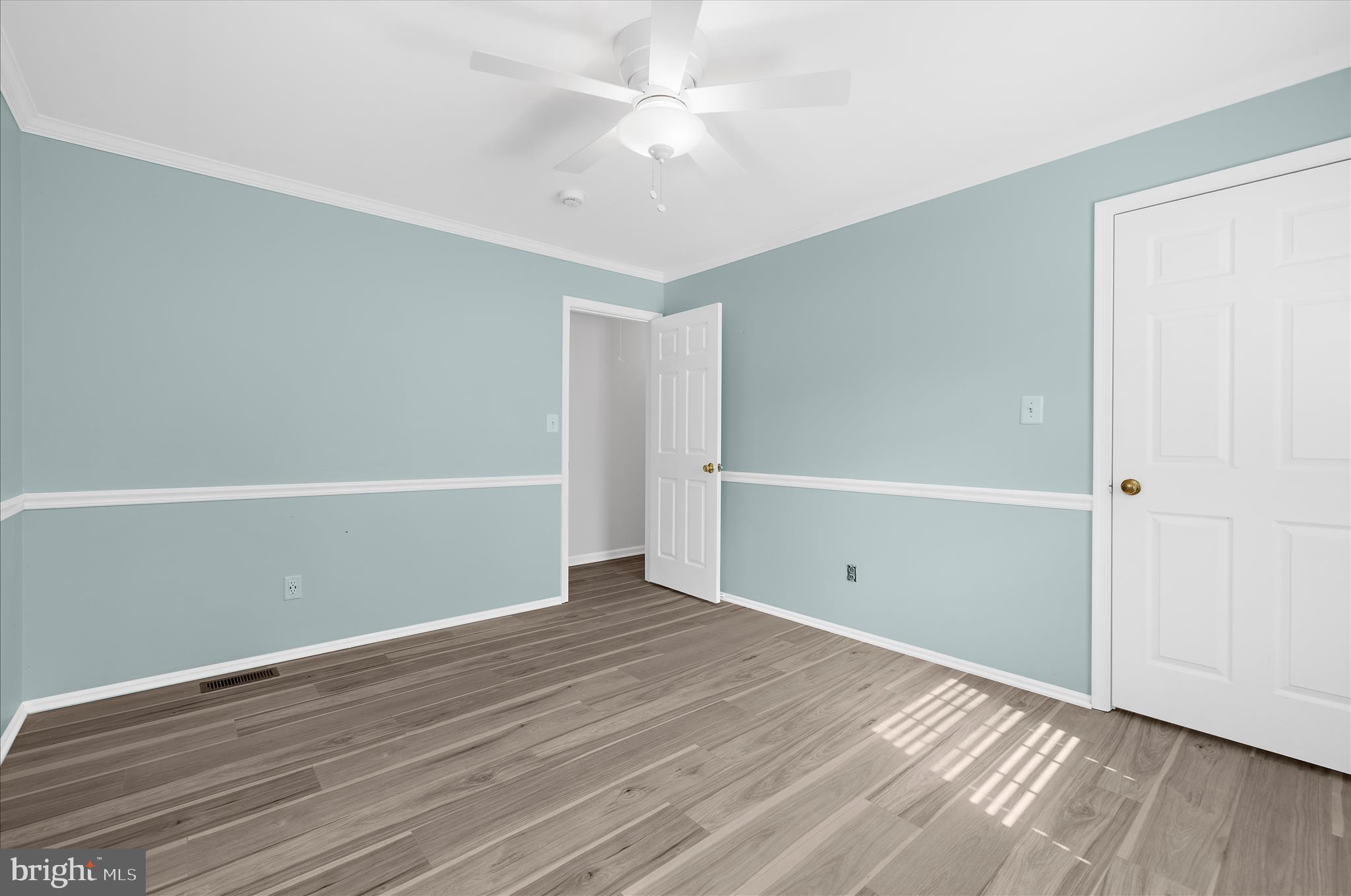 1126 Neptune Place Annapolis, MD 21409 - Photo 36 of 79 a view of an empty room with wooden floor