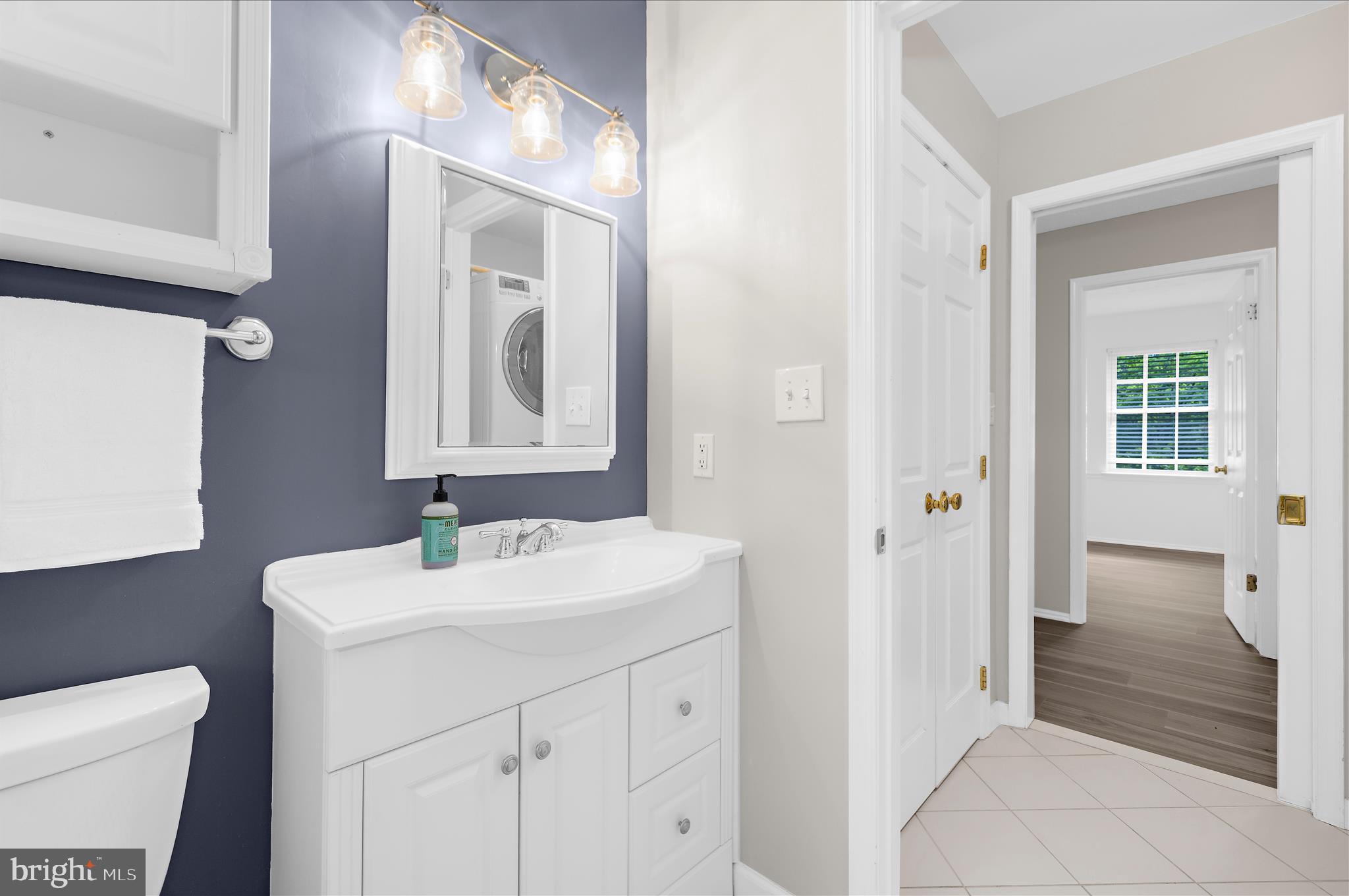 1126 Neptune Place Annapolis, MD 21409 - Photo 40 of 79 a bathroom with a sink and a mirror