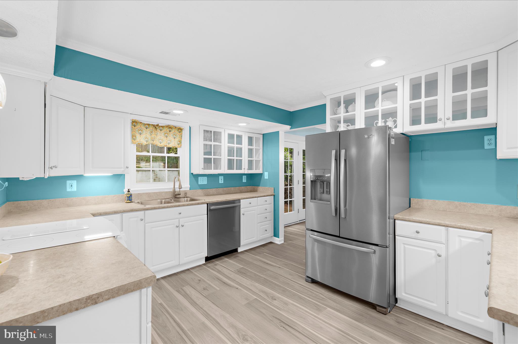 1126 Neptune Place Annapolis, MD 21409 - Photo 4 of 79 a kitchen with a refrigerator sink and cabinets