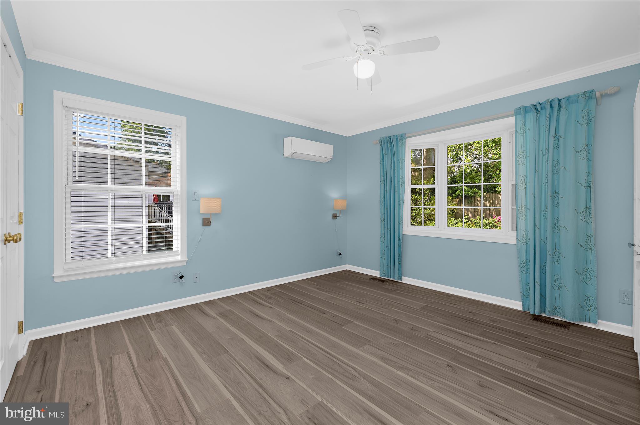 1126 Neptune Place Annapolis, MD 21409 - Photo 42 of 79 an empty room with wooden floor and windows