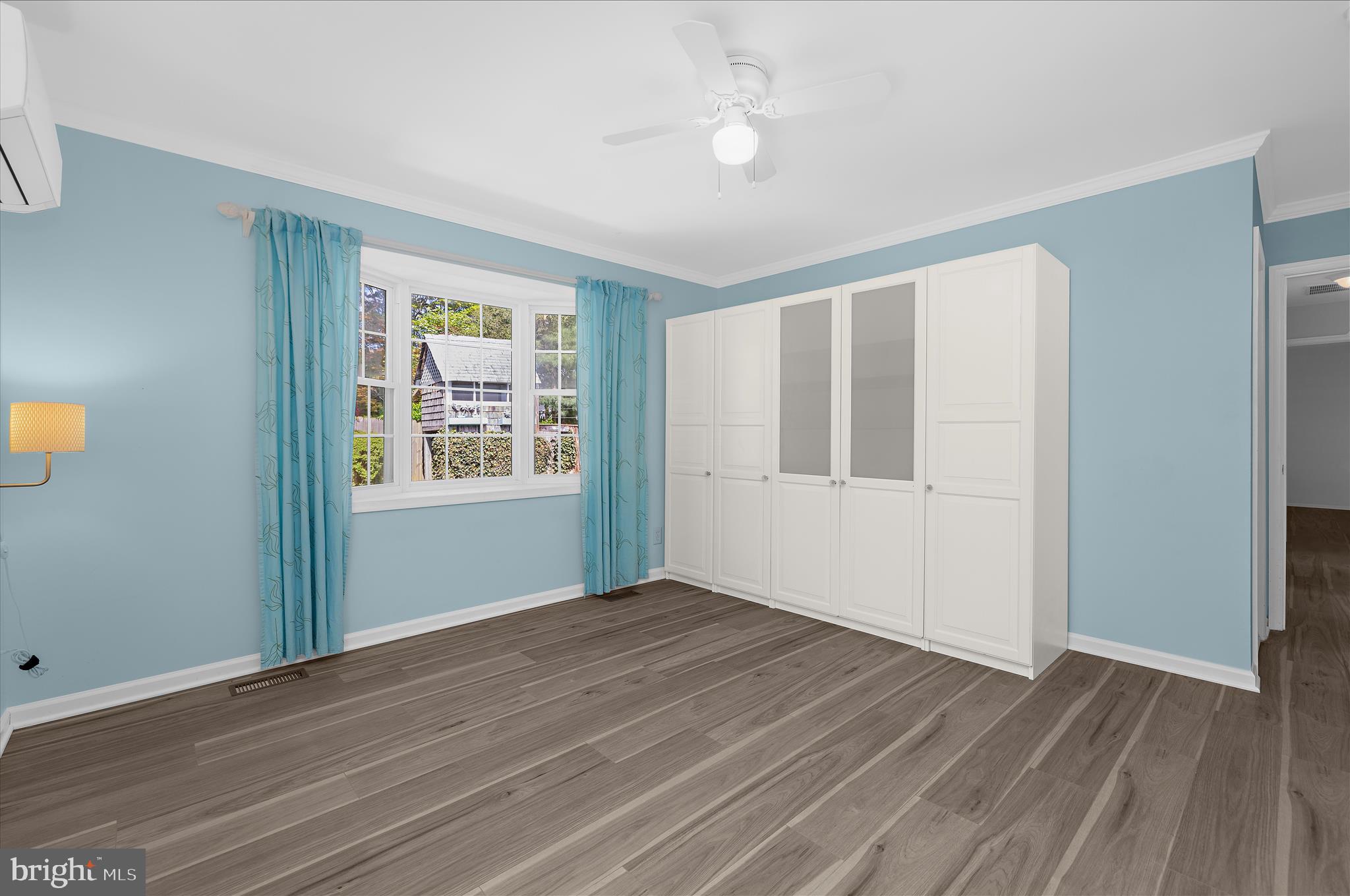 1126 Neptune Place Annapolis, MD 21409 - Photo 43 of 79 a view of an empty room with wooden floor and a window