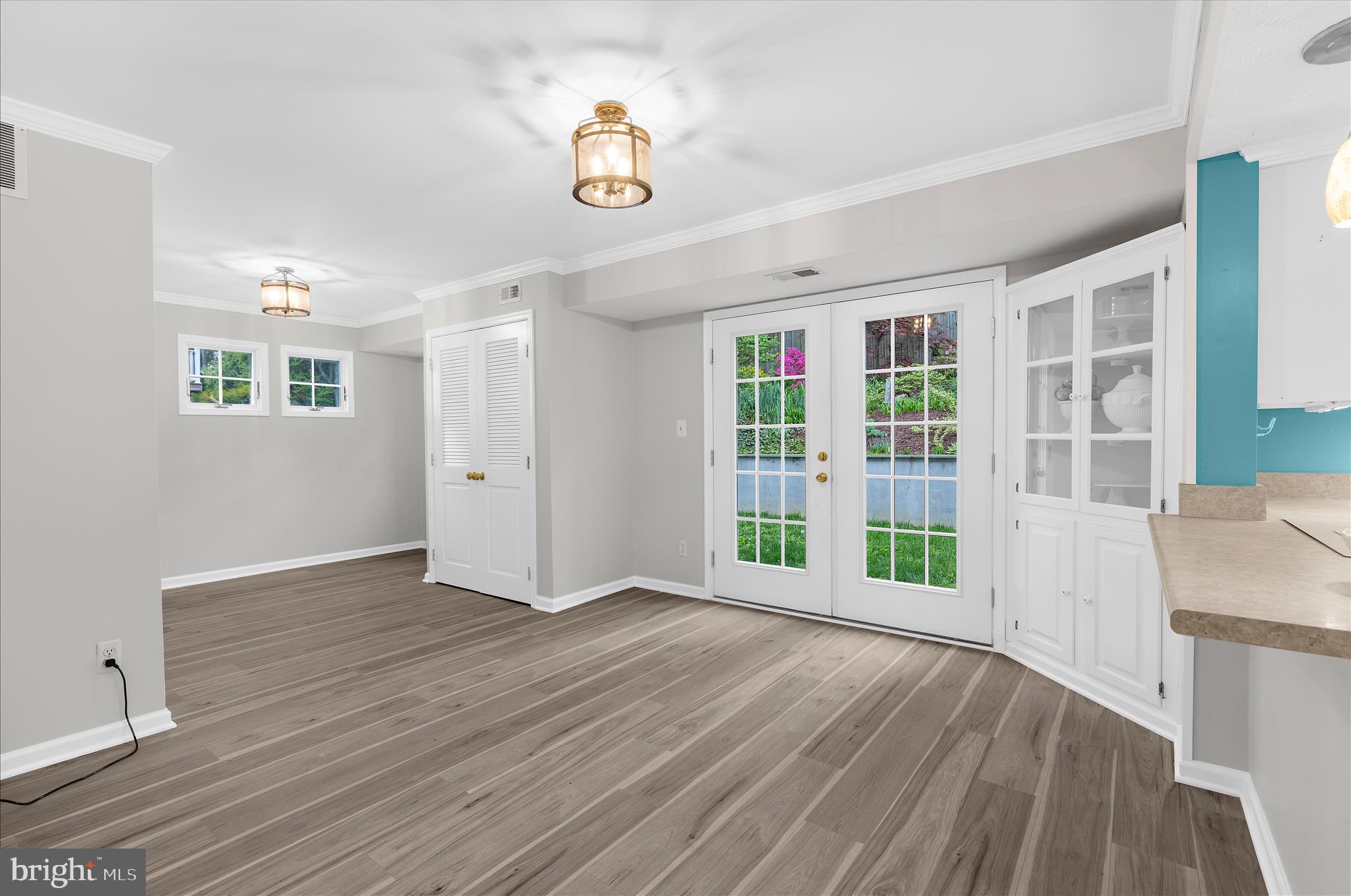 1126 Neptune Place Annapolis, MD 21409 - Photo 5 of 79 a view of an empty room with a window and wooden floor