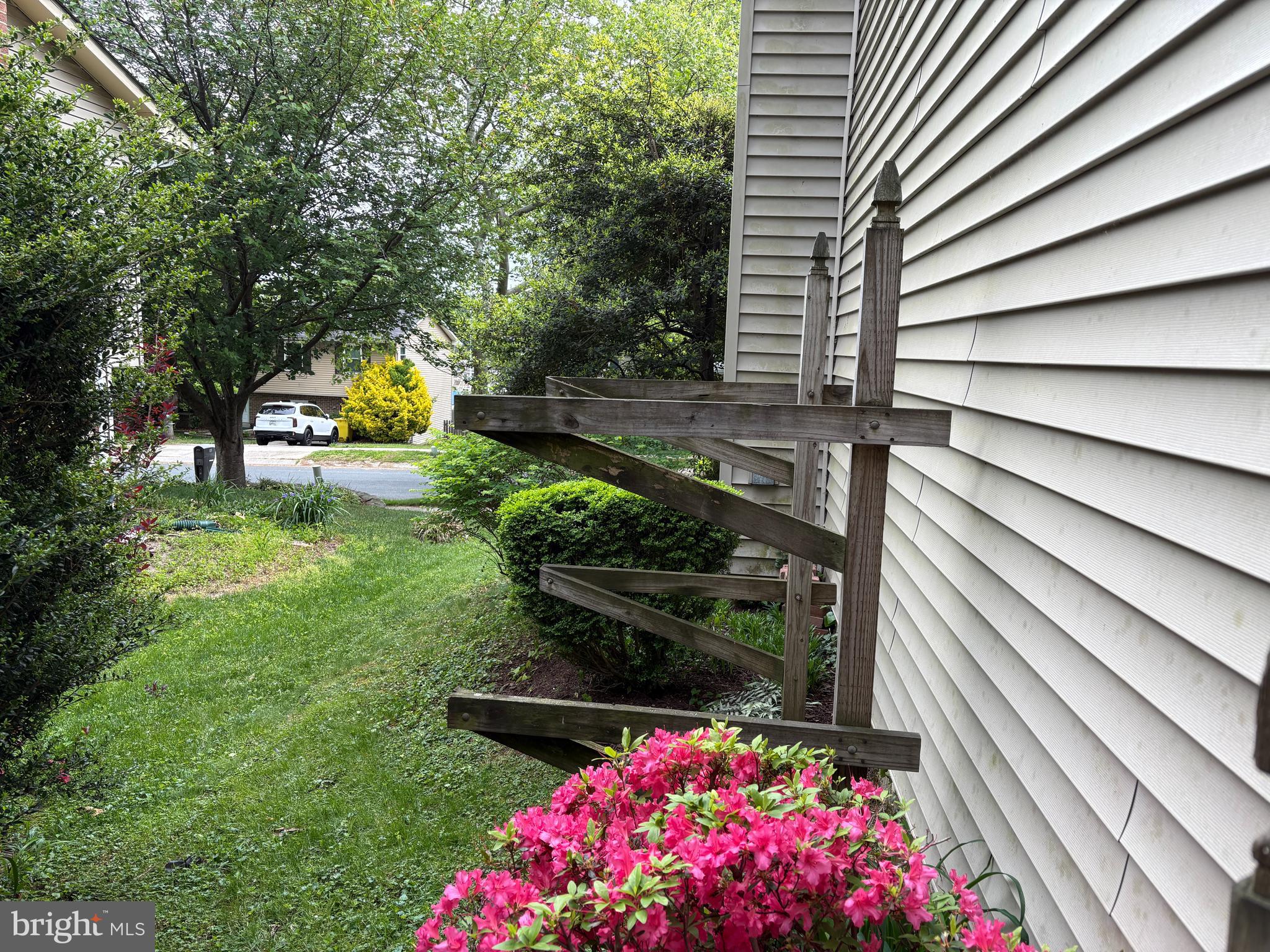 1126 Neptune Place Annapolis, MD 21409 - Photo 60 of 79 a backyard of a house with lots of green space and fountain