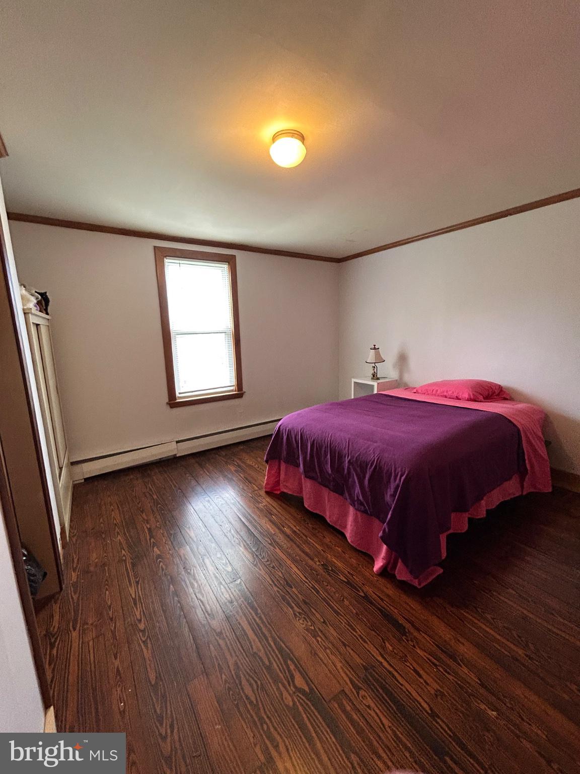 56 Maclay Street Milroy, PA 17063 - Photo 26 of 36 Cozy bedroom with warm wooden floors.
