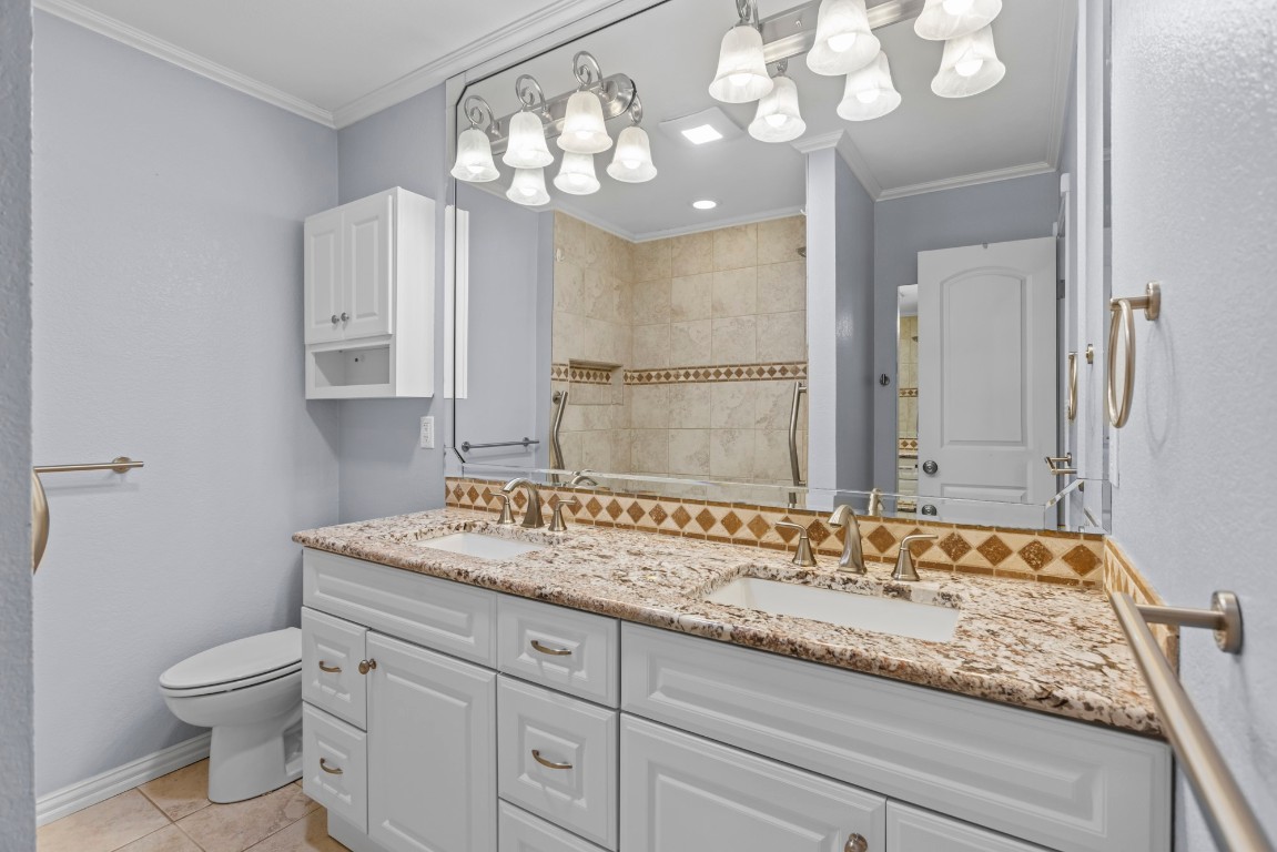 3745 Canyon Heights Road Belton, TX 76513 - Photo 23 of 29 a bathroom with a granite countertop sink a toilet and a mirror
