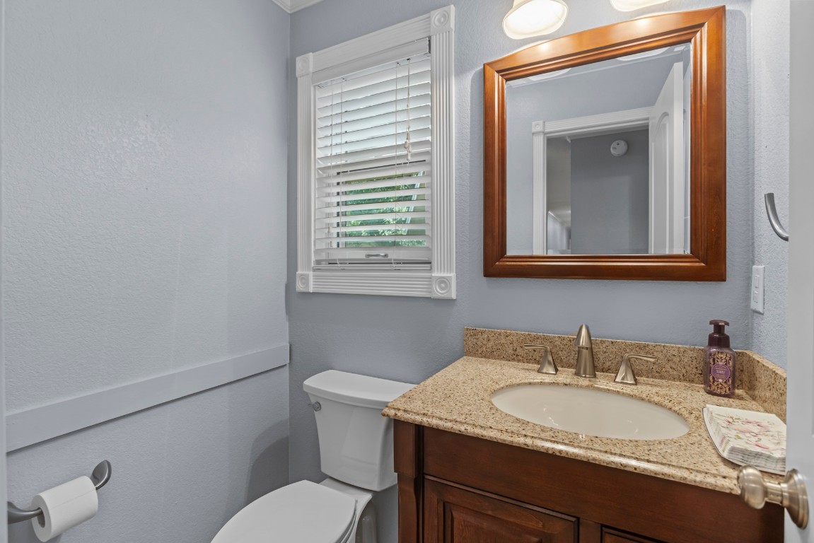 3745 Canyon Heights Road Belton, TX 76513 - Photo 24 of 29 a bathroom with a toilet sink and mirror