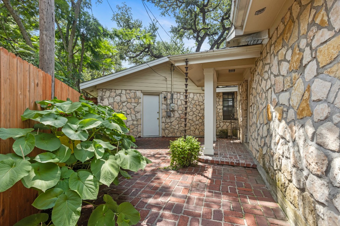 3745 Canyon Heights Road Belton, TX 76513 - Photo 27 of 29 a white house with a flower garden