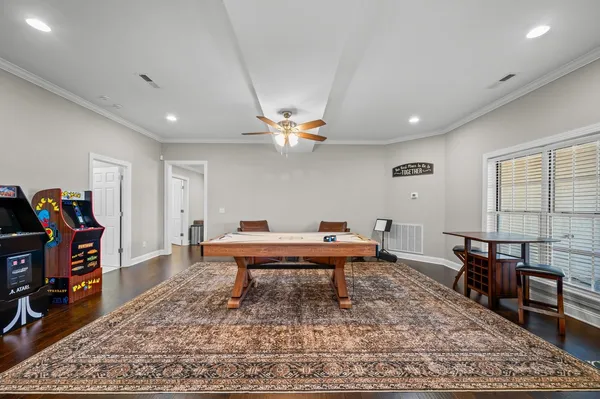 a reading room with furniture and wooden floor