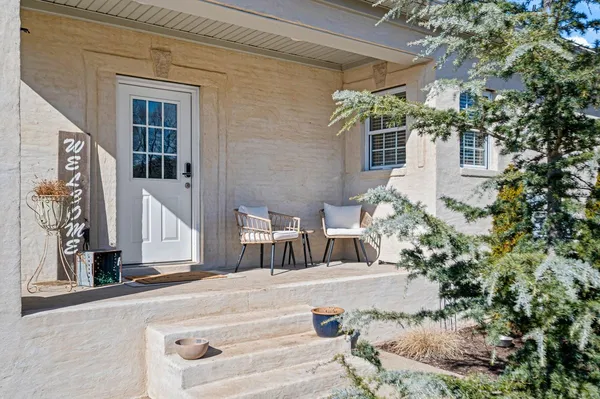 a view of a house with a yard and garage