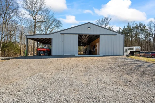 a view of a house with a yard and garage