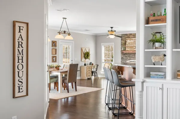 a view of a dining room with furniture window and wooden floor