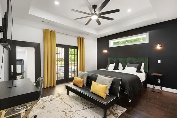 a bedroom with a bed window and a couch