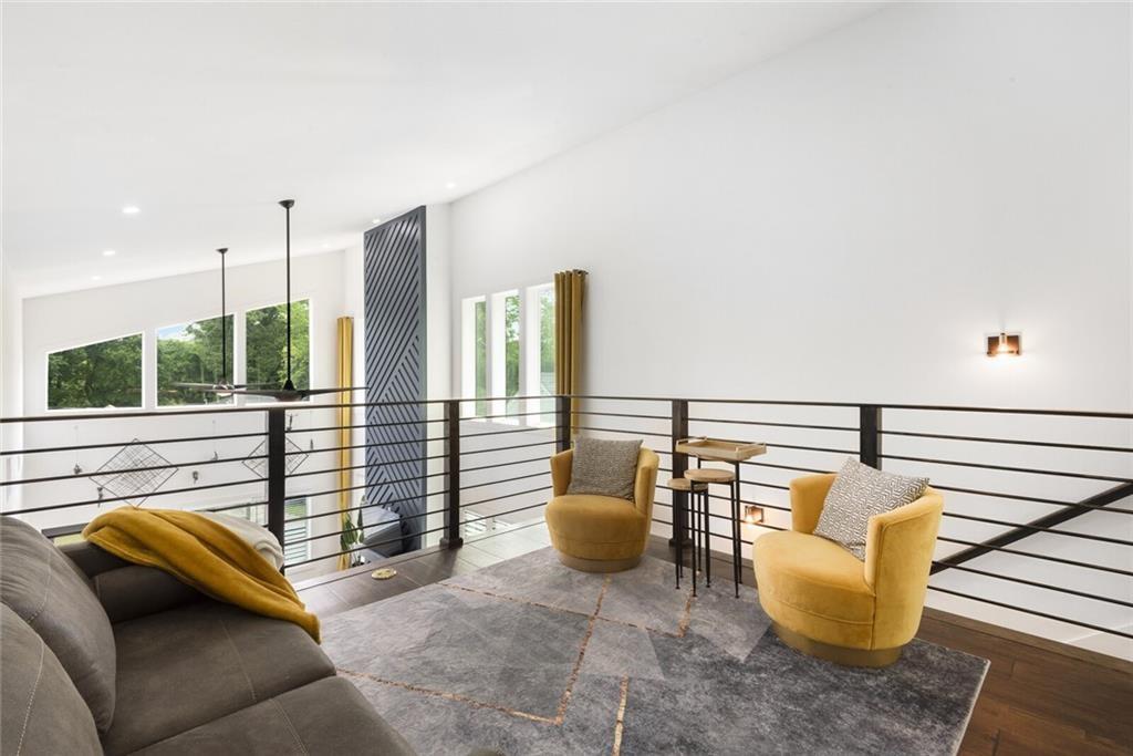 255 Mathewson Place Southwest Atlanta, GA 30314 - Photo 23 of 32 a balcony with chairs and a potted plant