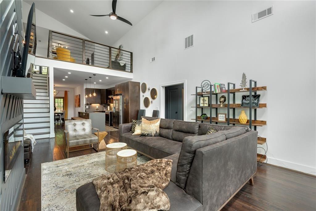 255 Mathewson Place Southwest Atlanta, GA 30314 - Photo 6 of 32 a living room with furniture and a chandelier
