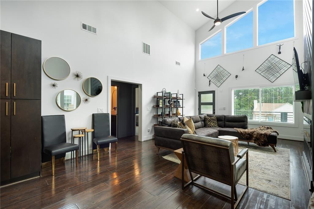 255 Mathewson Place Southwest Atlanta, GA 30314 - Photo 7 of 32 a living room with dining room and wooden floor