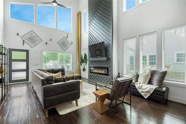 a living room with furniture and a fireplace