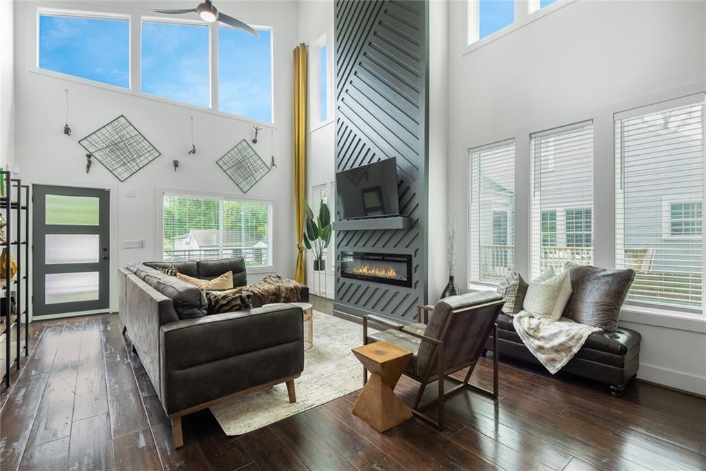 255 Mathewson Place Southwest Atlanta, GA 30314 - Photo 8 of 32 a living room with furniture and a fireplace