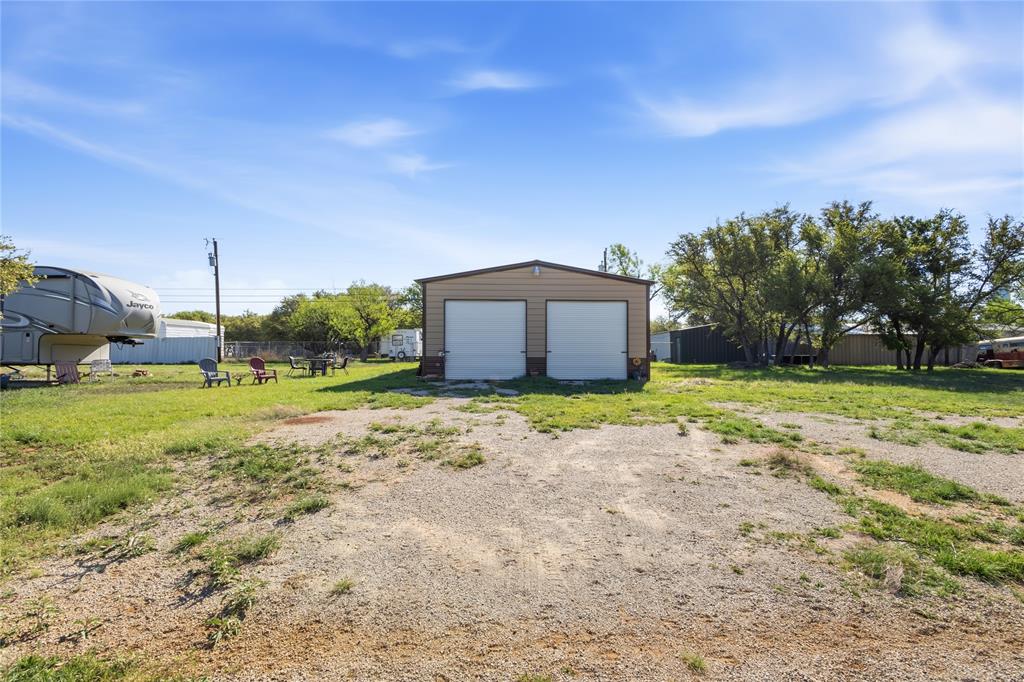 4441 Pawnee Drive May, TX 76857 - Photo 4 of 12 a house view with a garden space