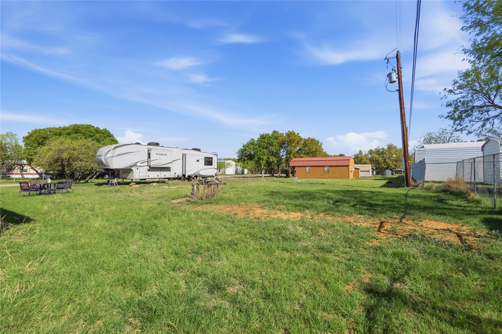4441 Pawnee Drive May, TX 76857 - Photo 5 of 12 a front view of a house with garden