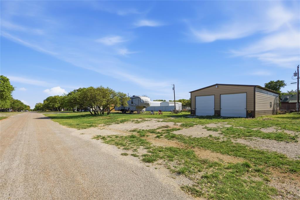 4441 Pawnee Drive May, TX 76857 - Photo 9 of 12 a house view with a garden space