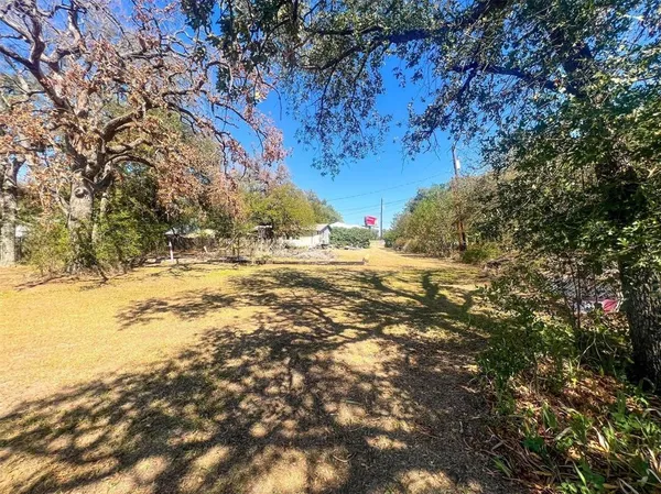 a view of yard covered with snow in the background
