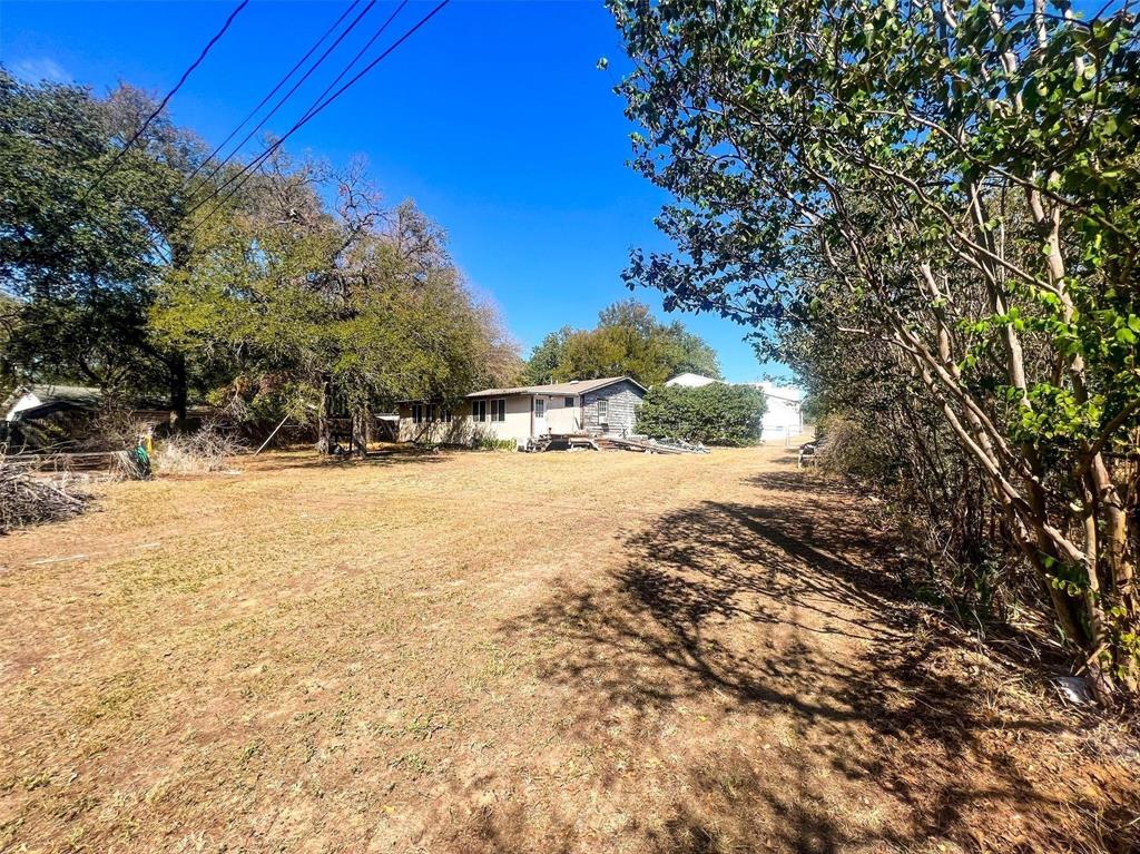 1833 W Highway, Unit AZ Springtown, TX 76082 - Photo 12 of 18 a view of yard covered with snow in the background