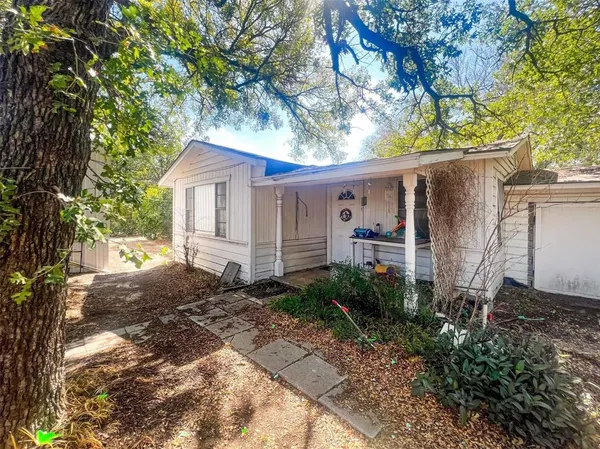 front view of a house with a trees