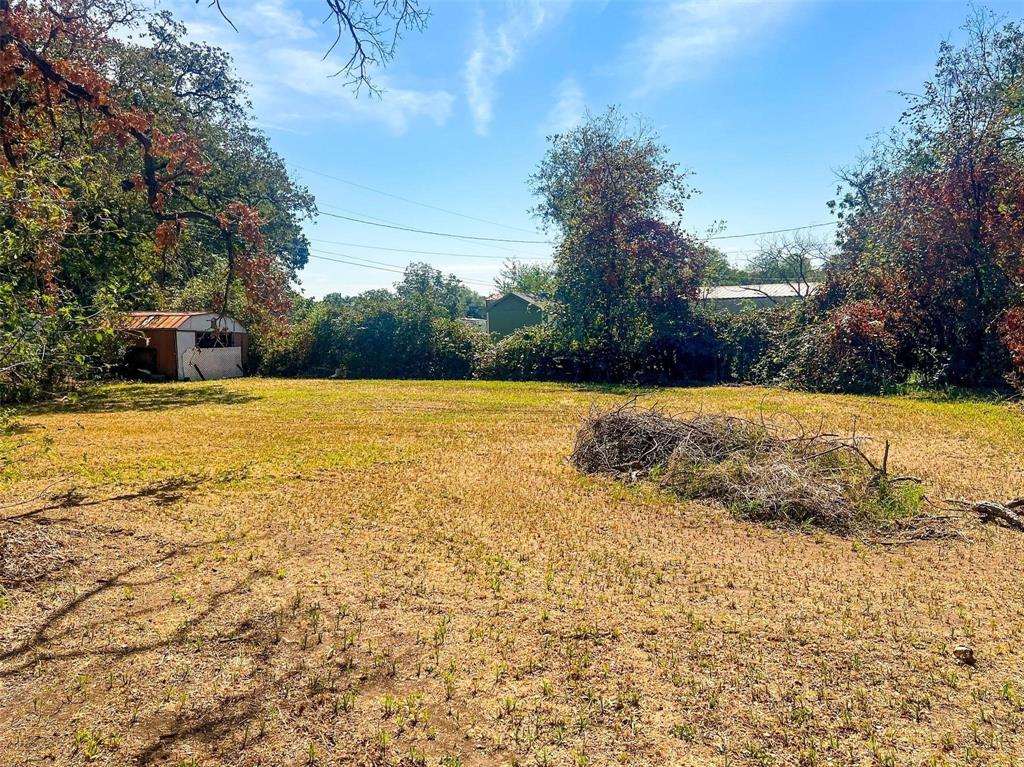 1833 W Highway, Unit AZ Springtown, TX 76082 - Photo 7 of 18 a view of yard with swimming pool and trees