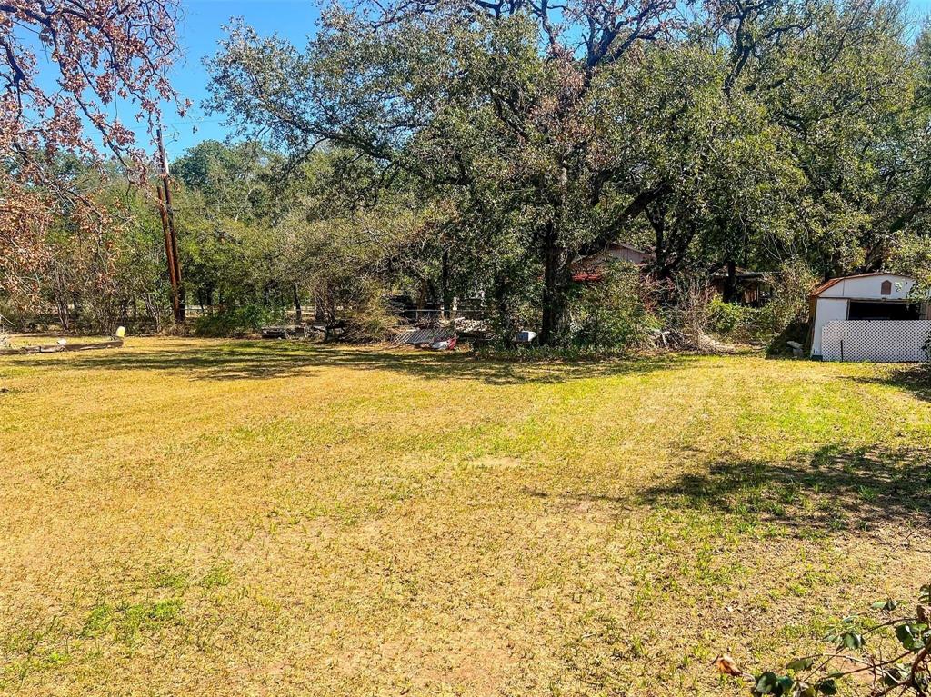 1833 W Highway, Unit AZ Springtown, TX 76082 - Photo 8 of 18 a view of a swimming pool with an outdoor space and seating area