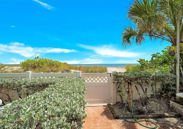 a view of a yard with an ocean view