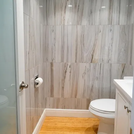a bathroom with a toilet and a shower curtain
