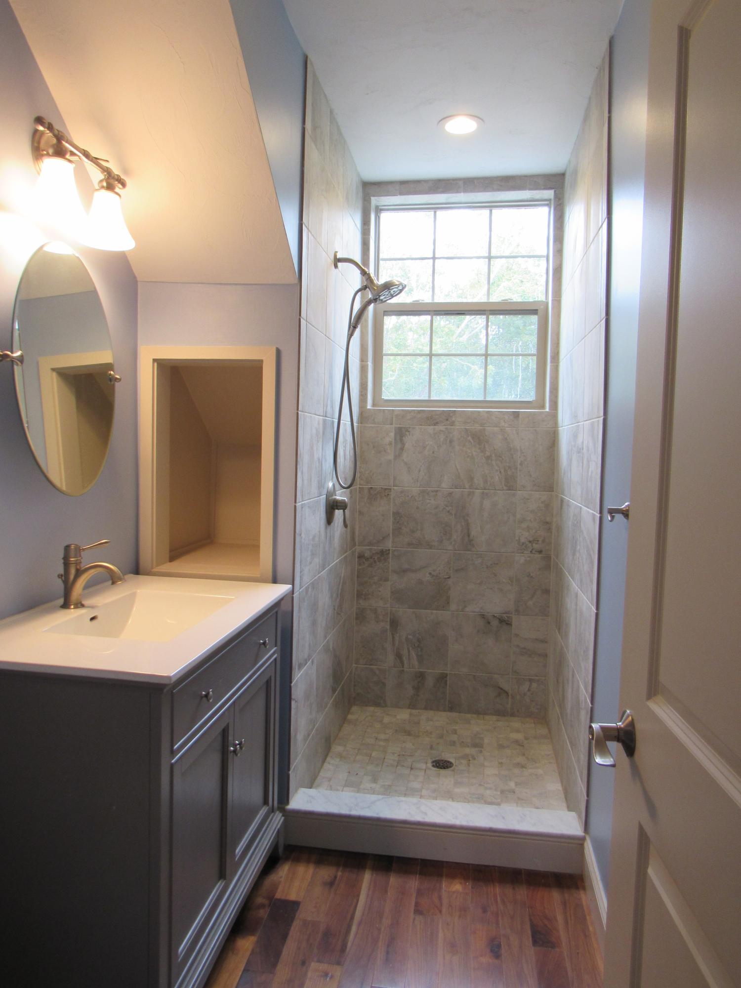 49-55 Rocky Point Road Bourne, MA 02532 - Photo 32 of 42 a bathroom with a shower a sink and a mirror