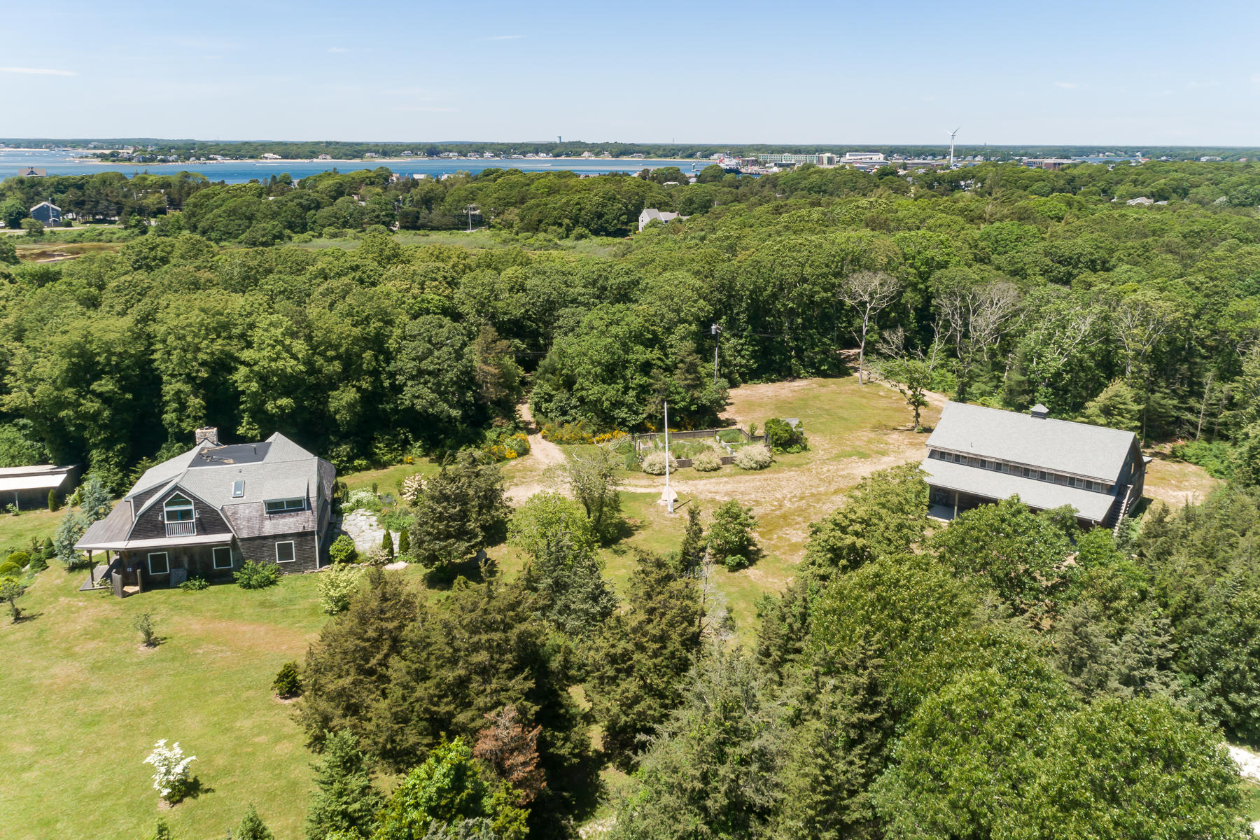 49-55 Rocky Point Road Bourne, MA 02532 - Photo 36 of 42 a view of a house with a yard and lake view