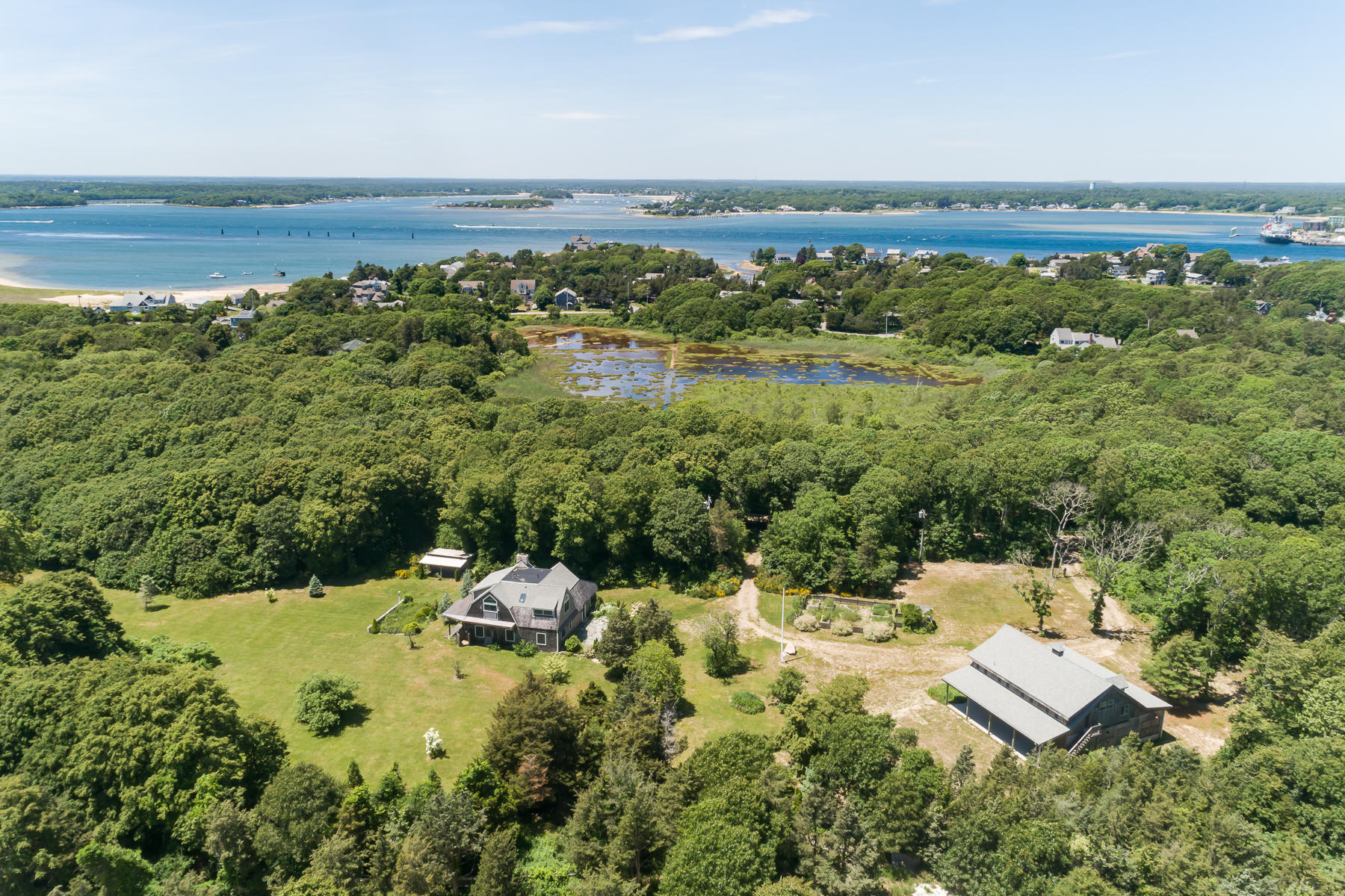 49-55 Rocky Point Road Bourne, MA 02532 - Photo 39 of 42 a view of a lake with a city