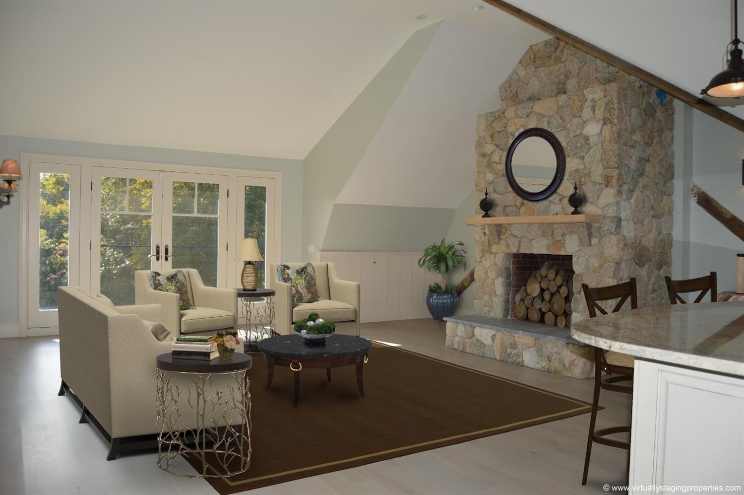 49-55 Rocky Point Road Bourne, MA 02532 - Photo 9 of 42 a living room with furniture a fireplace a large window and potted plant