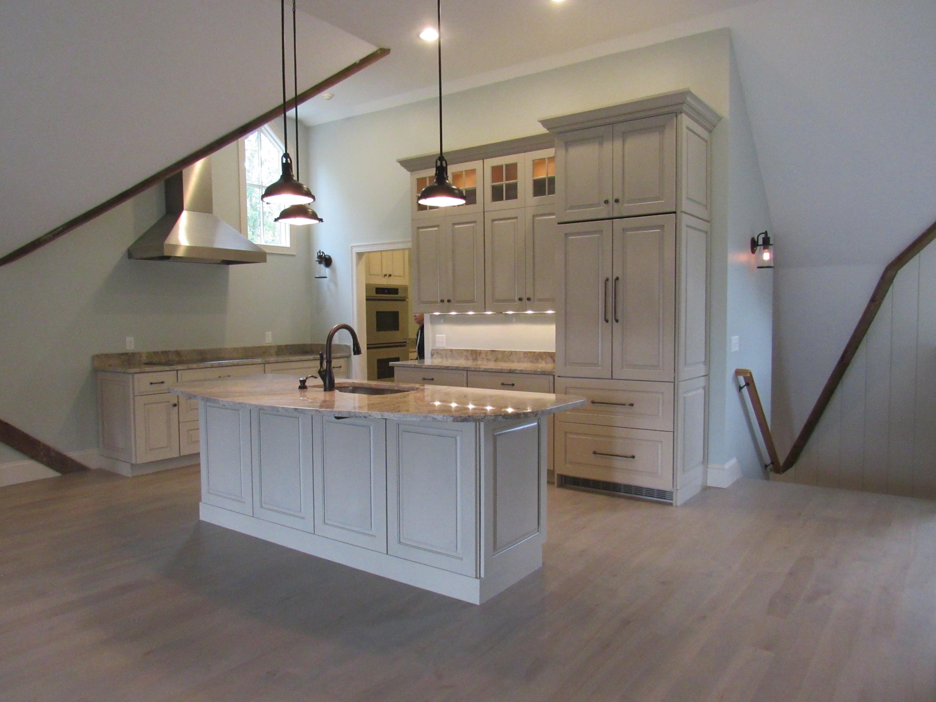 49-55 Rocky Point Road Bourne, MA 02532 - Photo 10 of 42 a kitchen with refrigerator and cabinets